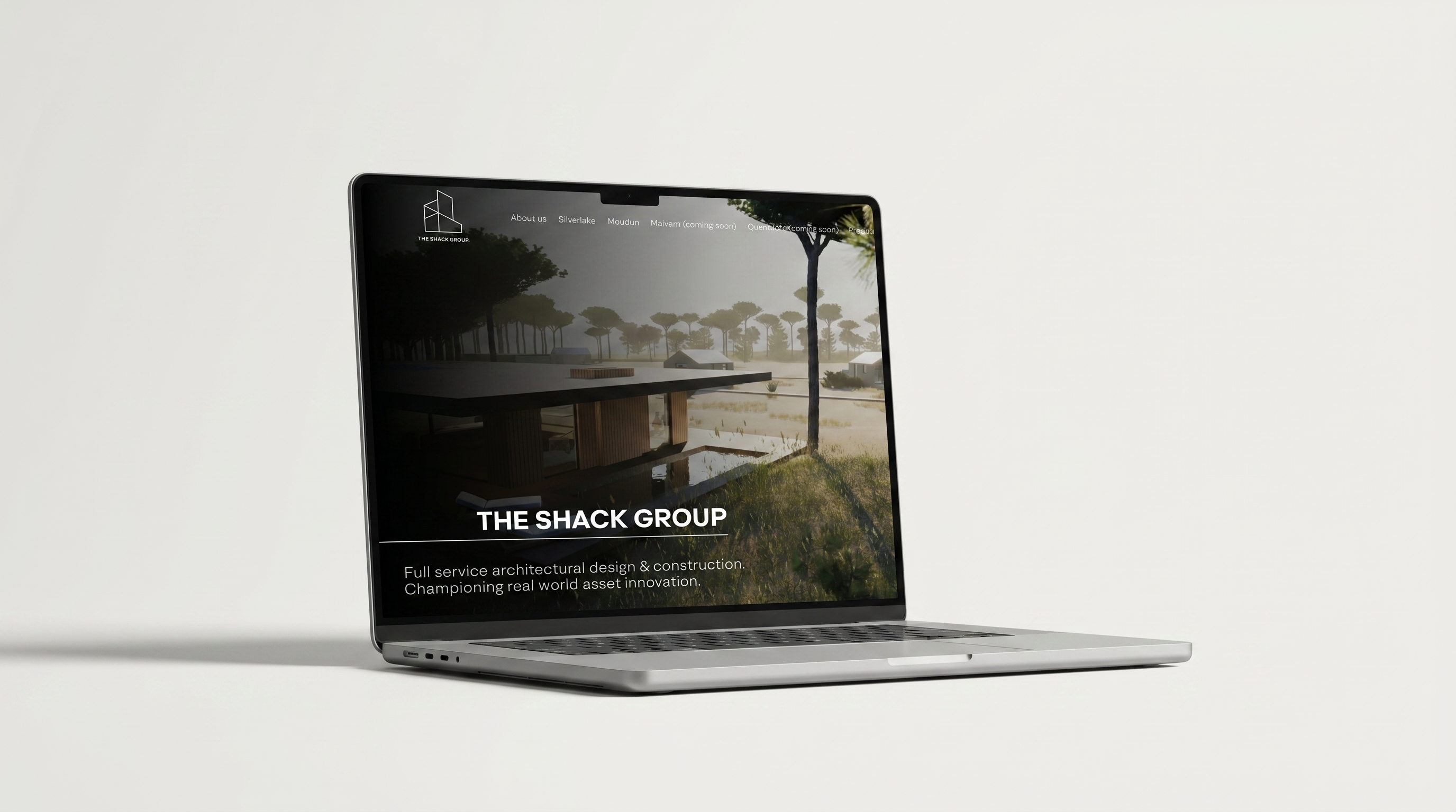 The Shack Group website shown on a laptop